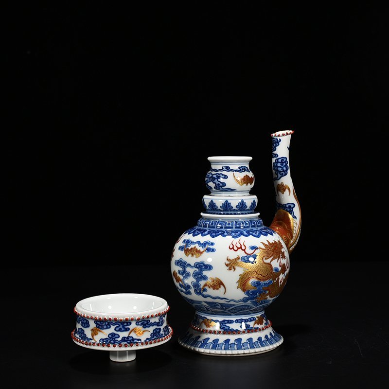 Qing Dynasty Qianlong blue and white alum red Baba teapot