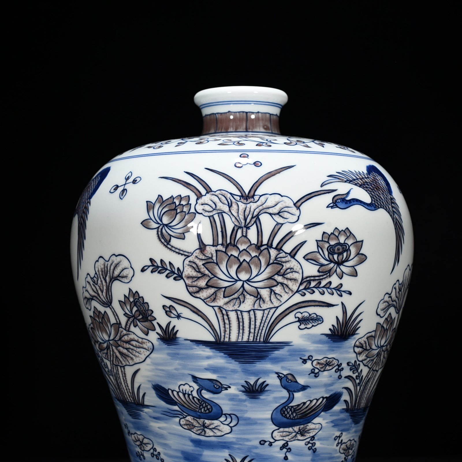Qing Dynasty Qianlong blue and white underglaze red lotus pond plum vase