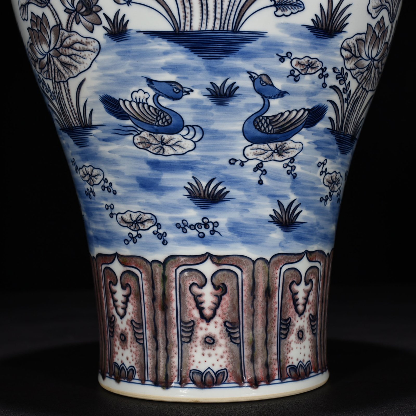 Qing Dynasty Qianlong blue and white underglaze red lotus pond plum vase