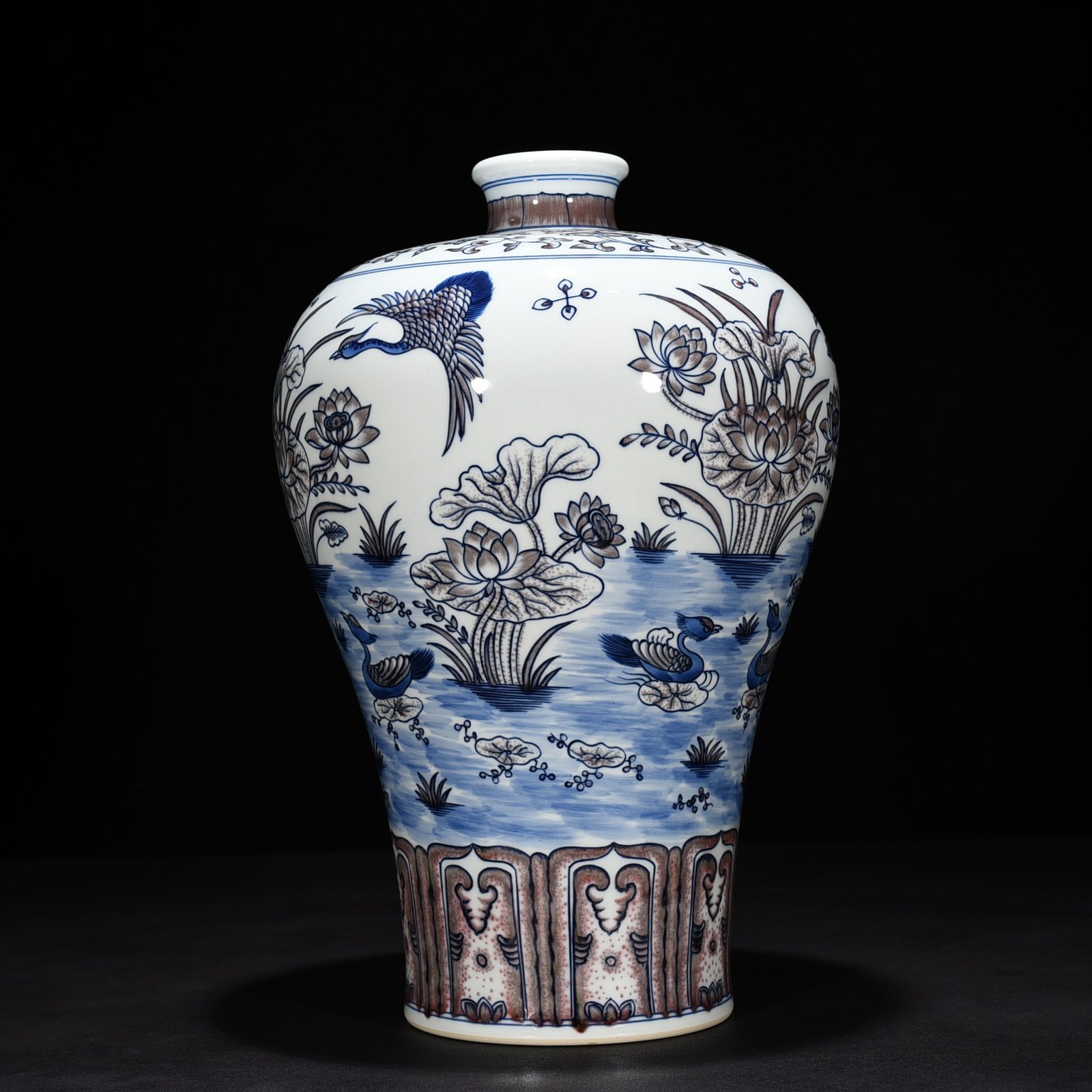 Qing Dynasty Qianlong blue and white underglaze red lotus pond plum vase