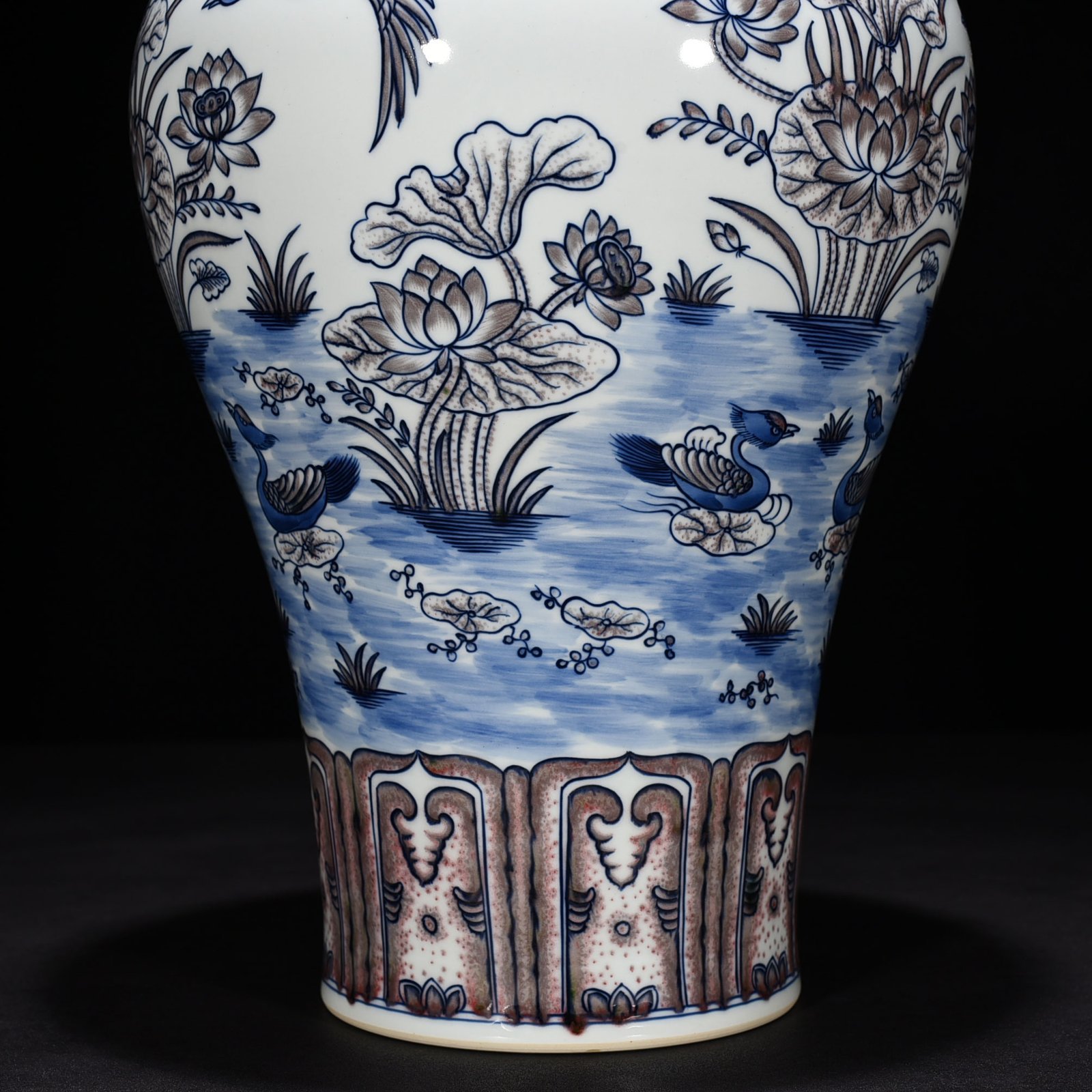 Qing Dynasty Qianlong blue and white underglaze red lotus pond plum vase