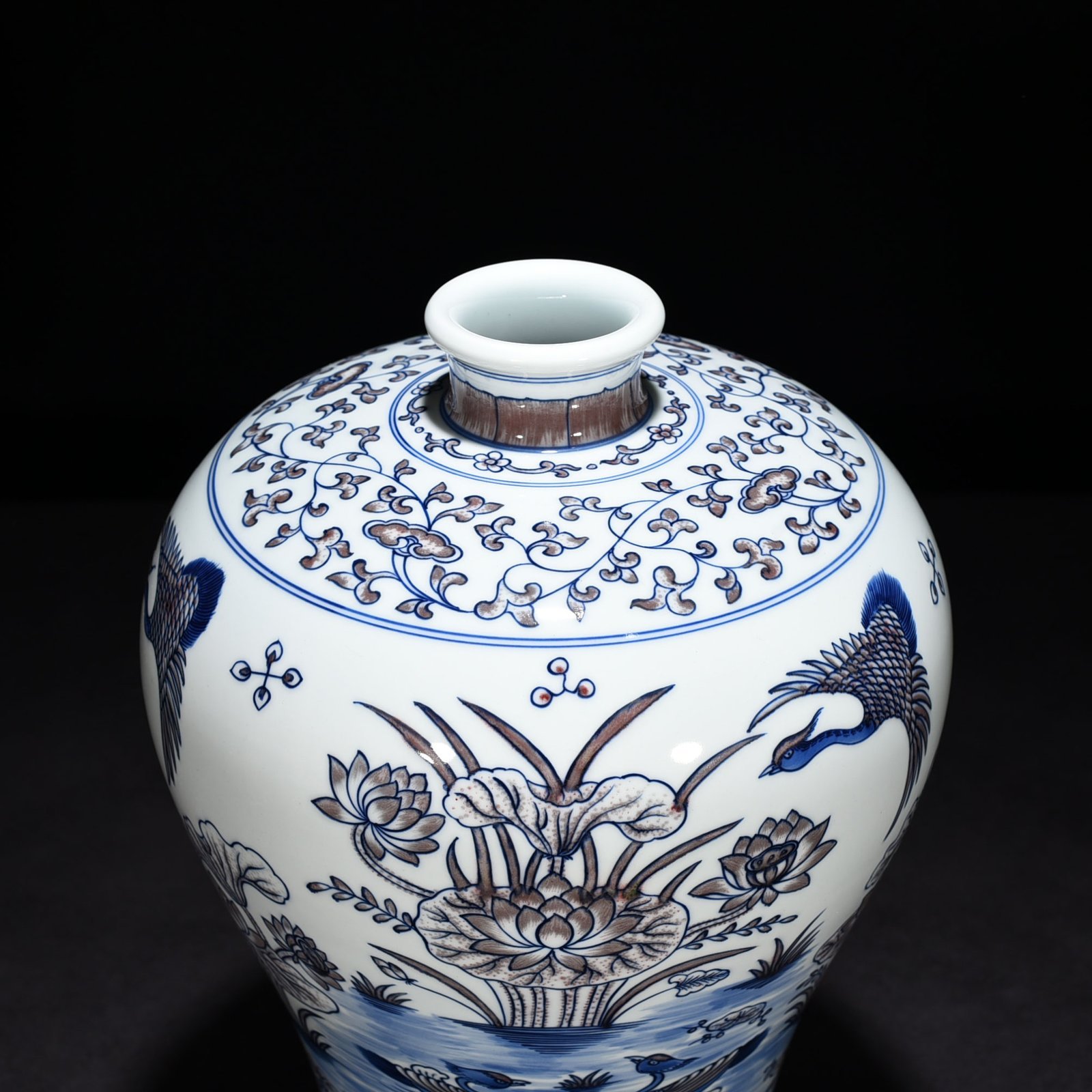 Qing Dynasty Qianlong blue and white underglaze red lotus pond plum vase