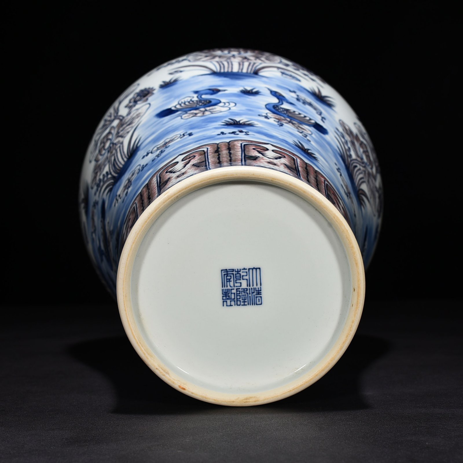 Qing Dynasty Qianlong blue and white underglaze red lotus pond plum vase