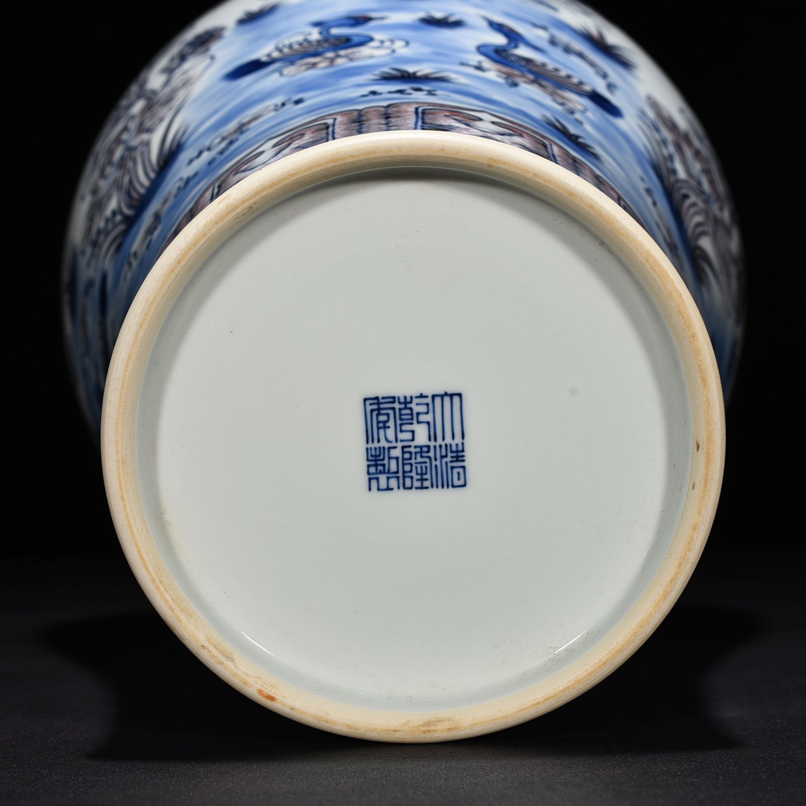 Qing Dynasty Qianlong blue and white underglaze red lotus pond plum vase