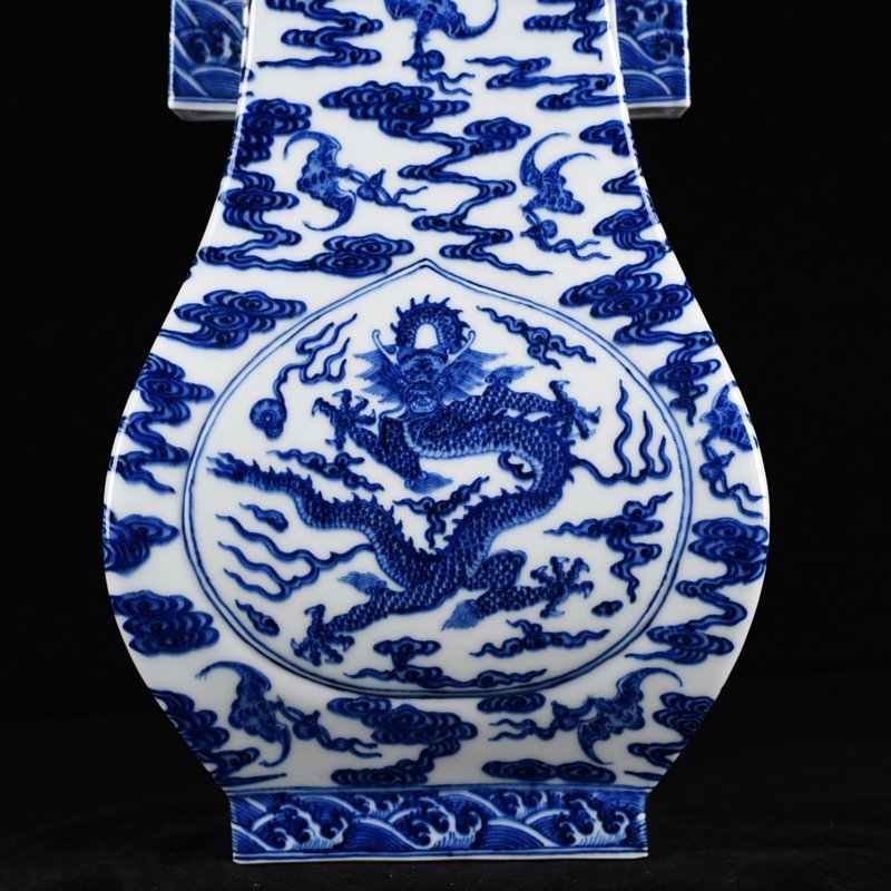 Qing Dynasty Qianlong blue and white dragon through-ear vase