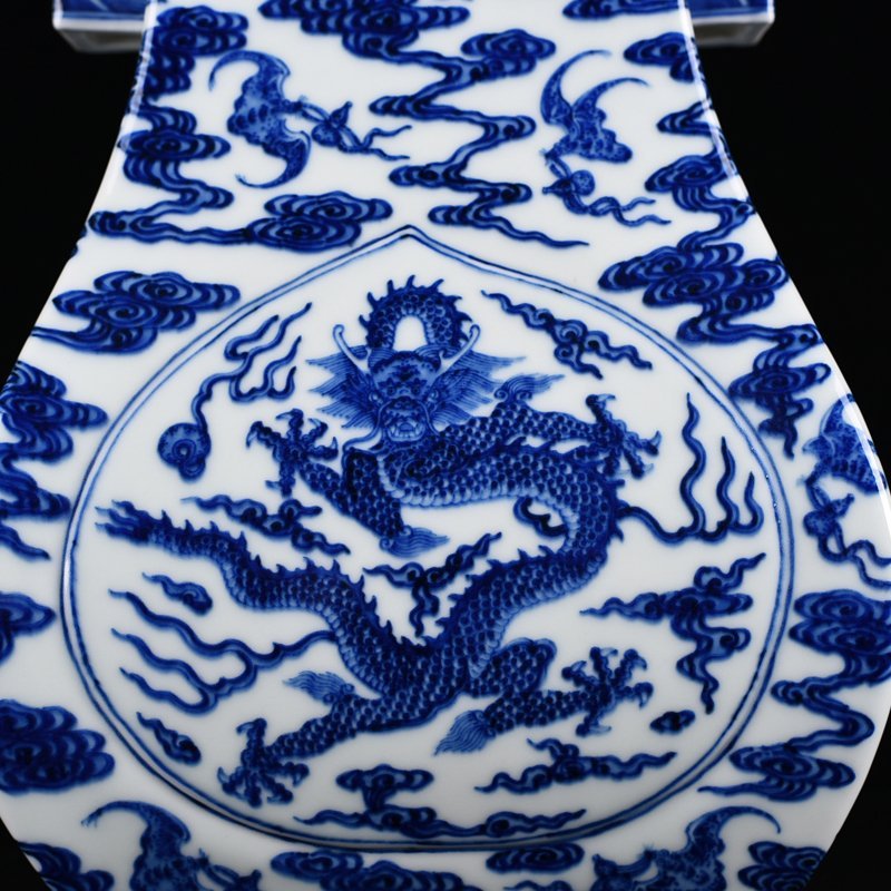 Qing Dynasty Qianlong blue and white dragon through-ear vase
