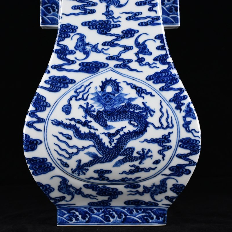 Qing Dynasty Qianlong blue and white dragon through-ear vase