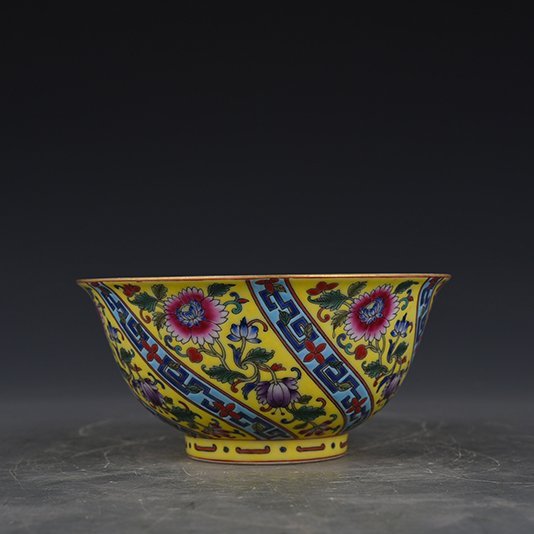 Qing Dynasty Qianlong yellow ground enamel flower bowl