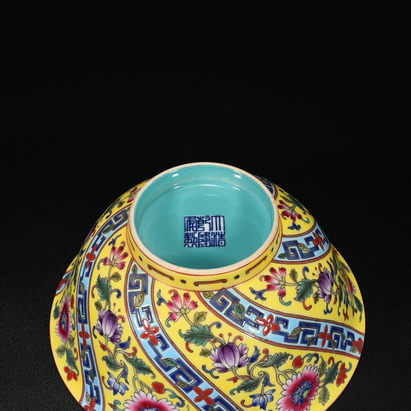 Qing Dynasty Qianlong yellow ground pastel flower bowl