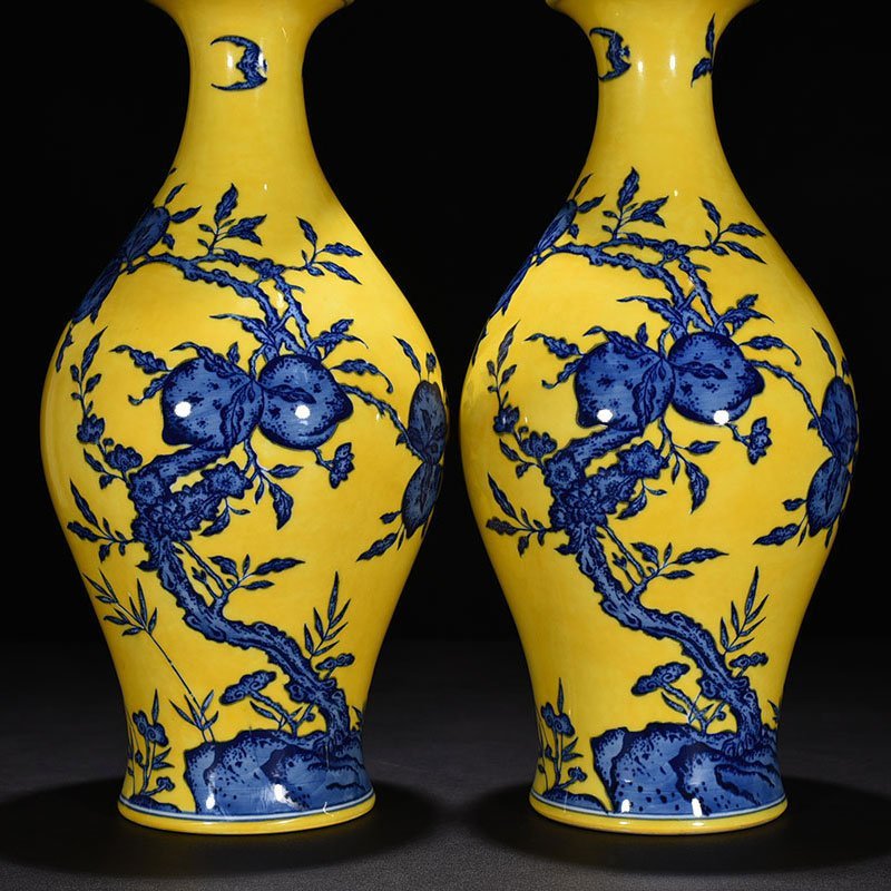 Qing Dynasty Qianlong yellow ground blue and white olive vase
