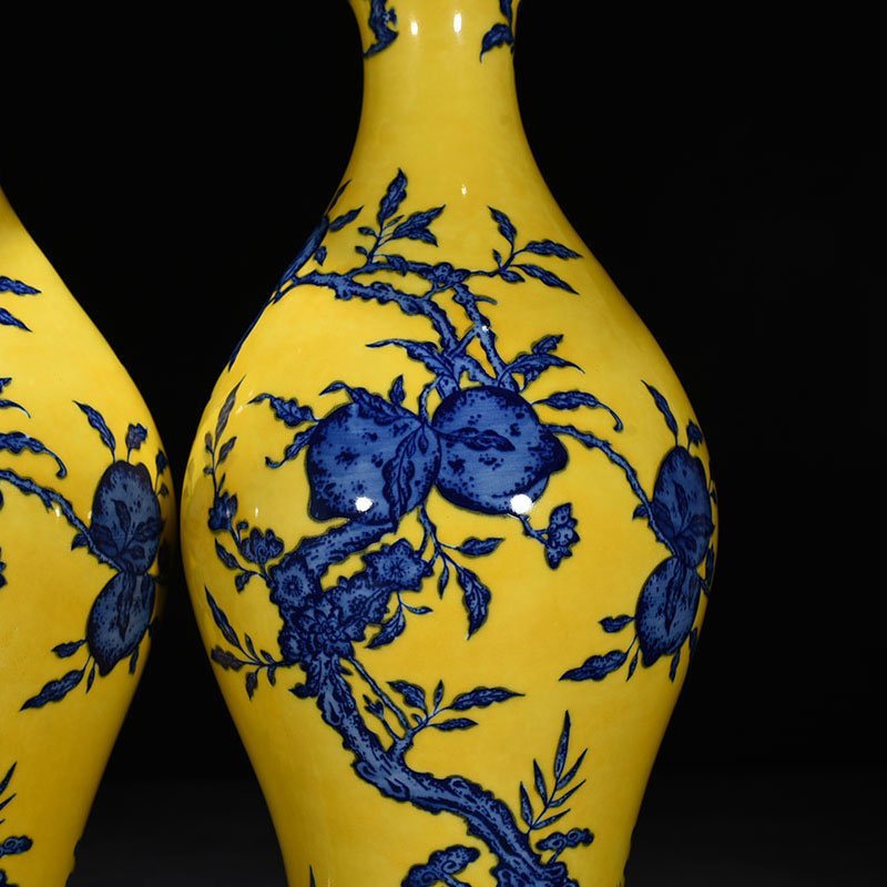 Qing Dynasty Qianlong yellow ground blue and white olive vase