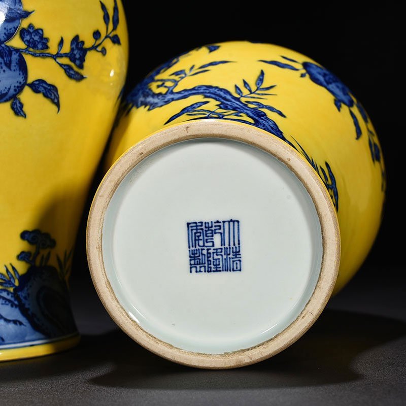 Qing Dynasty Qianlong yellow ground blue and white olive vase