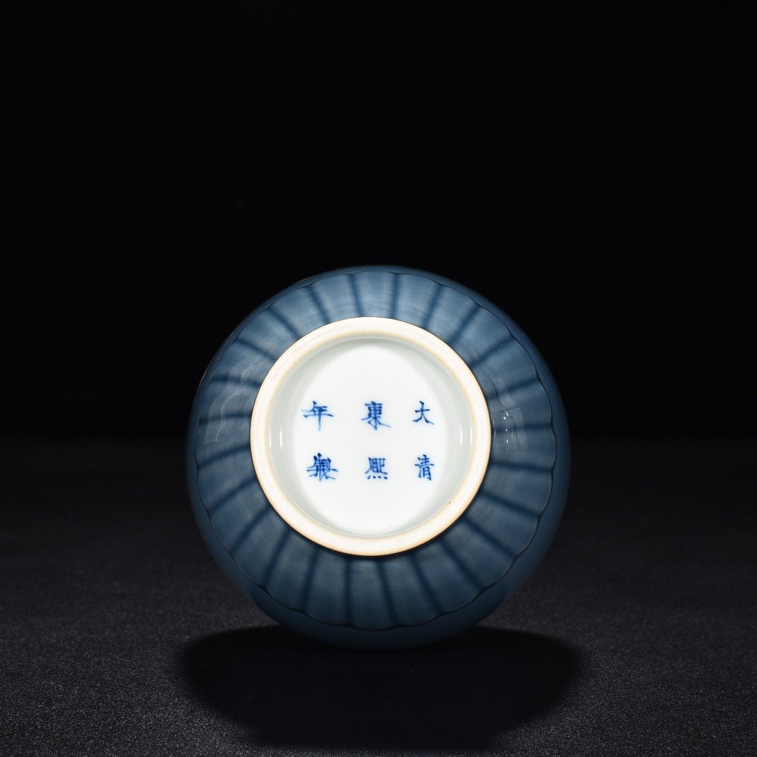 Qing Dynasty Kangxi sky blue glaze chrysanthemum petal vase