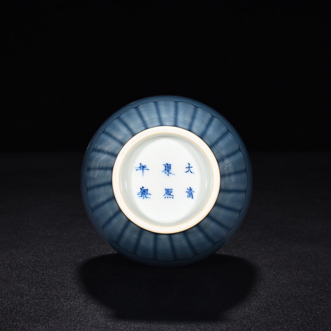 Qing Dynasty Kangxi sky blue glaze chrysanthemum petal vase