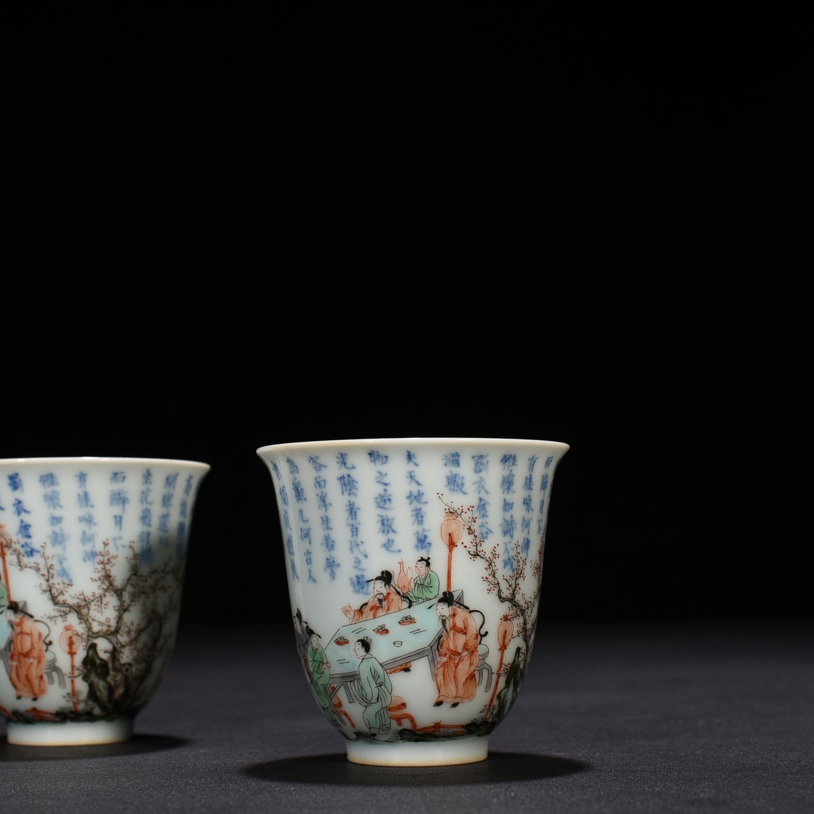 Qing Dynasty Kangxi blue and white colorful peach and plum garden poetry bell cup