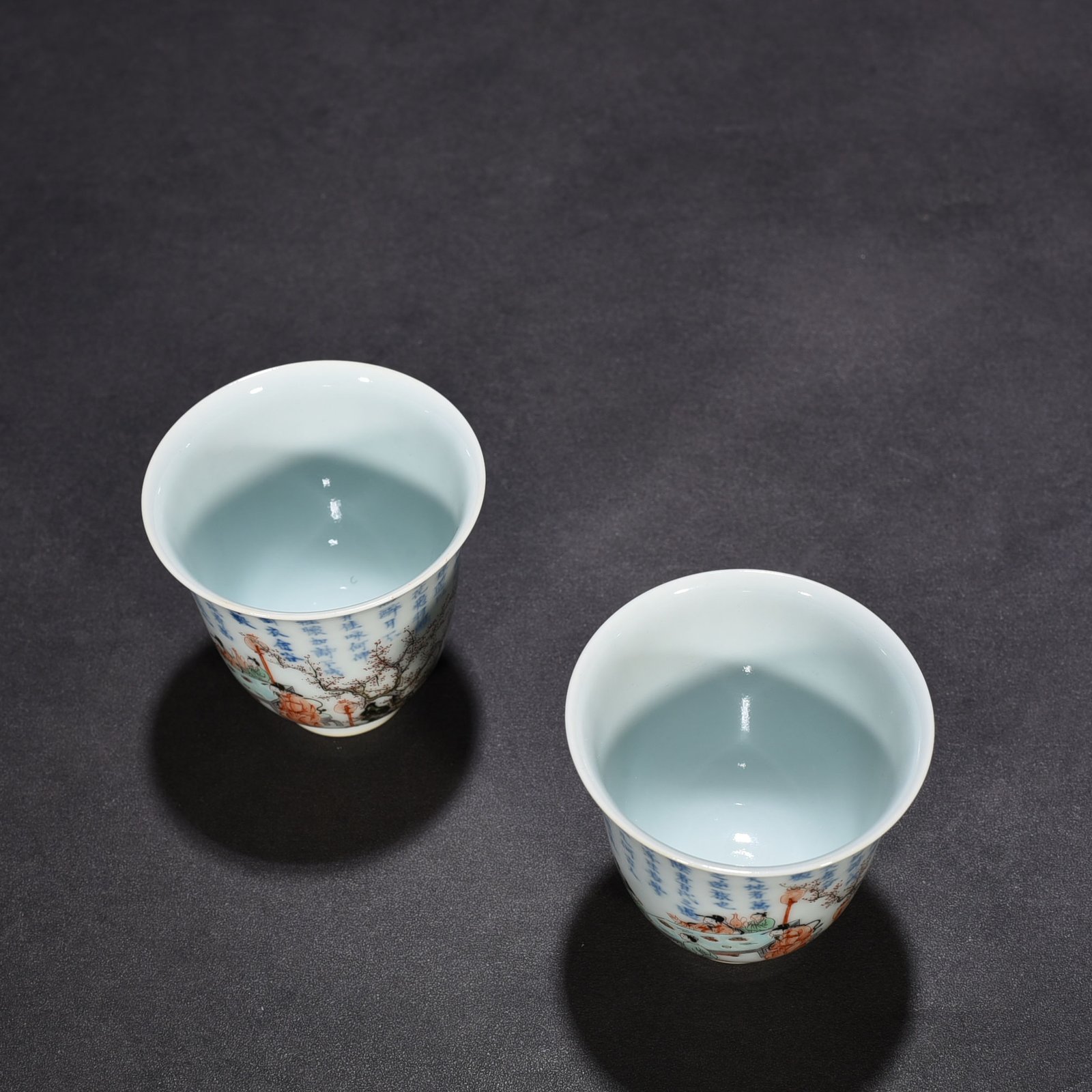 Qing Dynasty Kangxi blue and white colorful peach and plum garden poetry bell cup