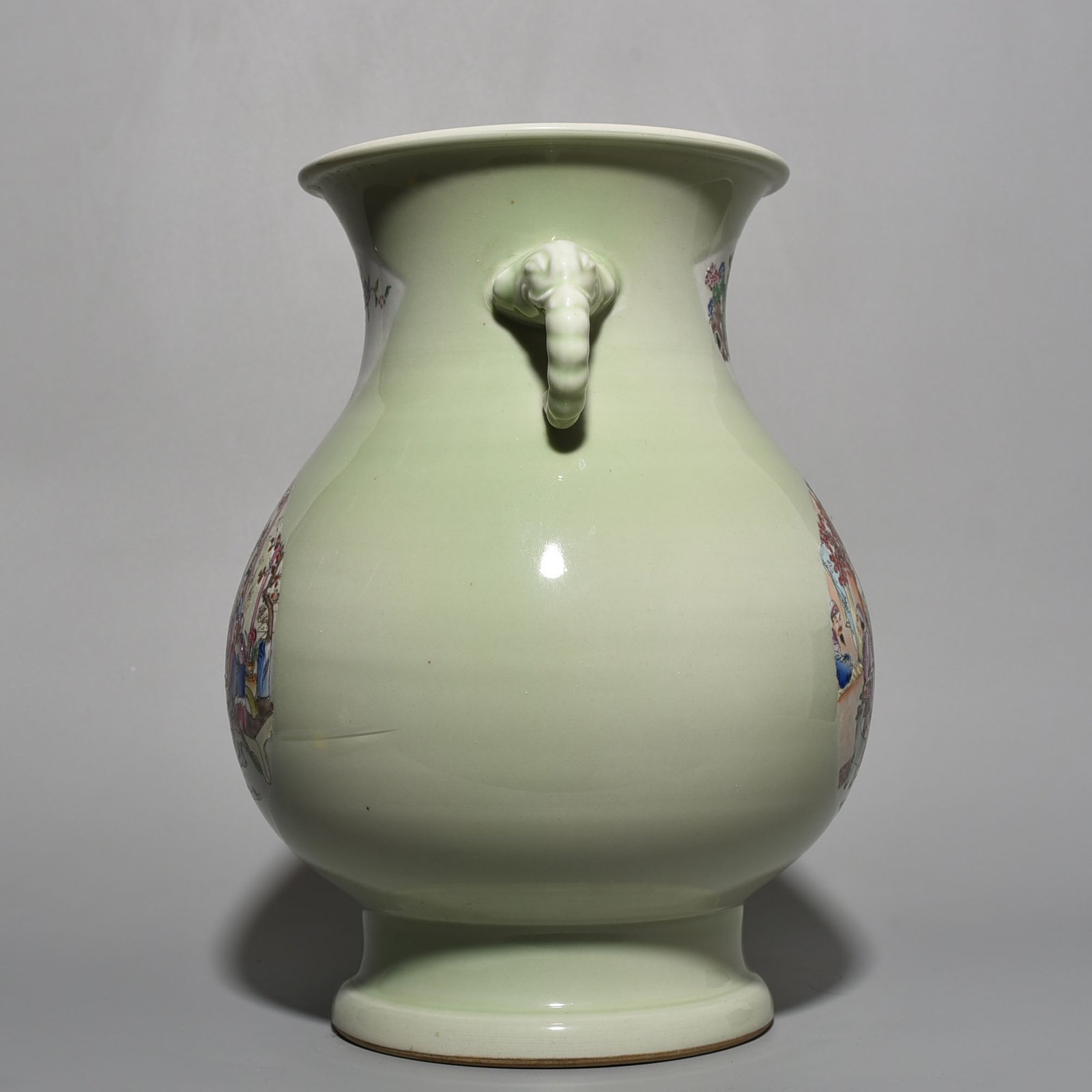 Qing Dynasty Kangxi bean green glaze pastel figure elephant ear statue