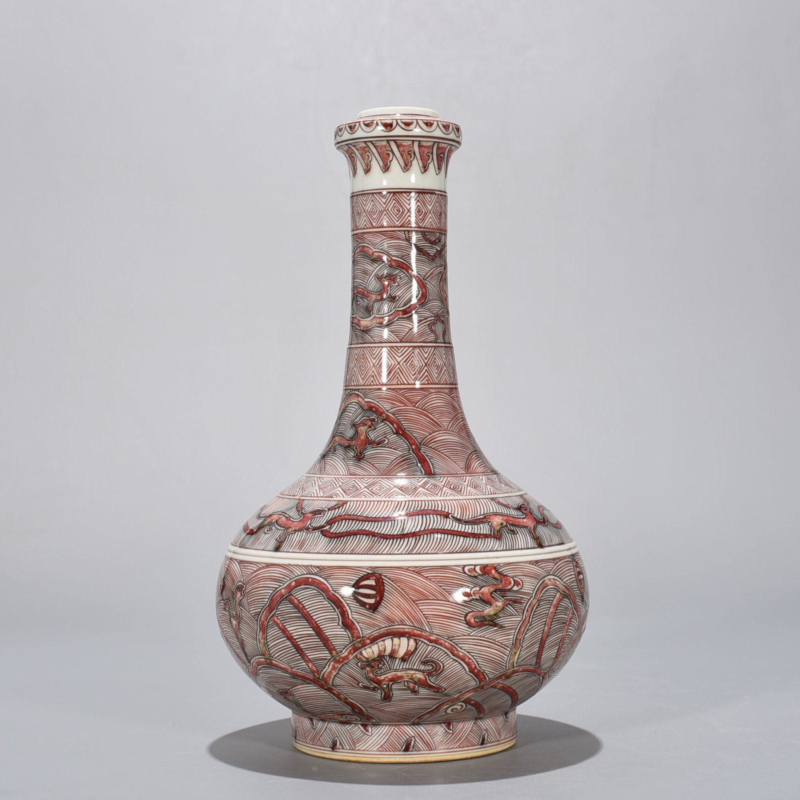 Qing Dynasty Kangxi underglaze red sea animal garlic bottle