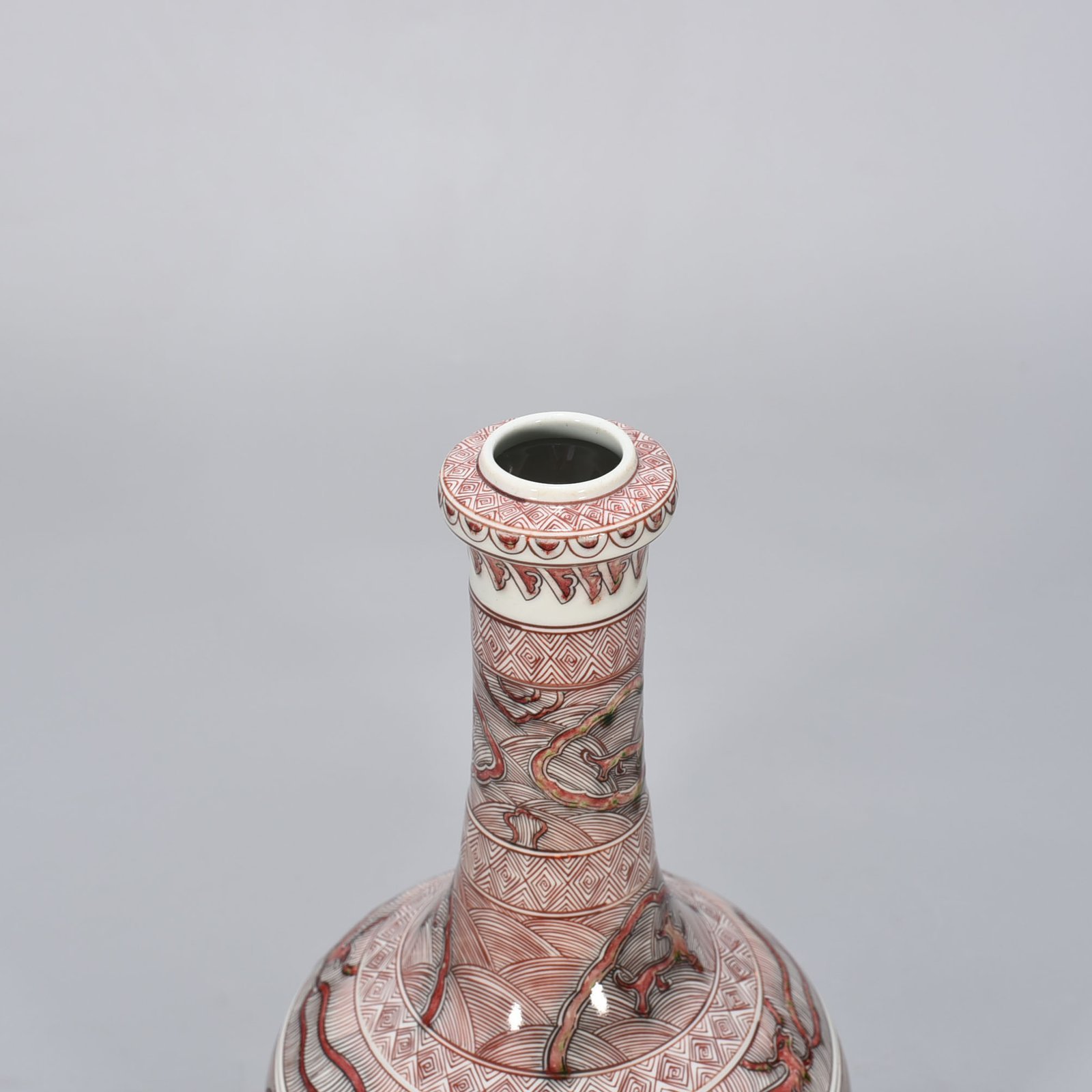 Qing Dynasty Kangxi underglaze red sea animal garlic bottle
