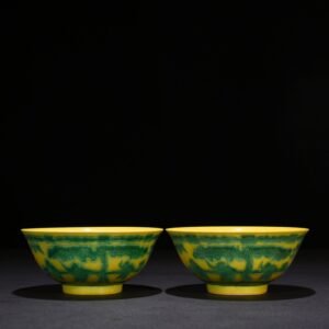 Qing Dynasty Kangxi yellow glaze engraved green color baby playing bowl