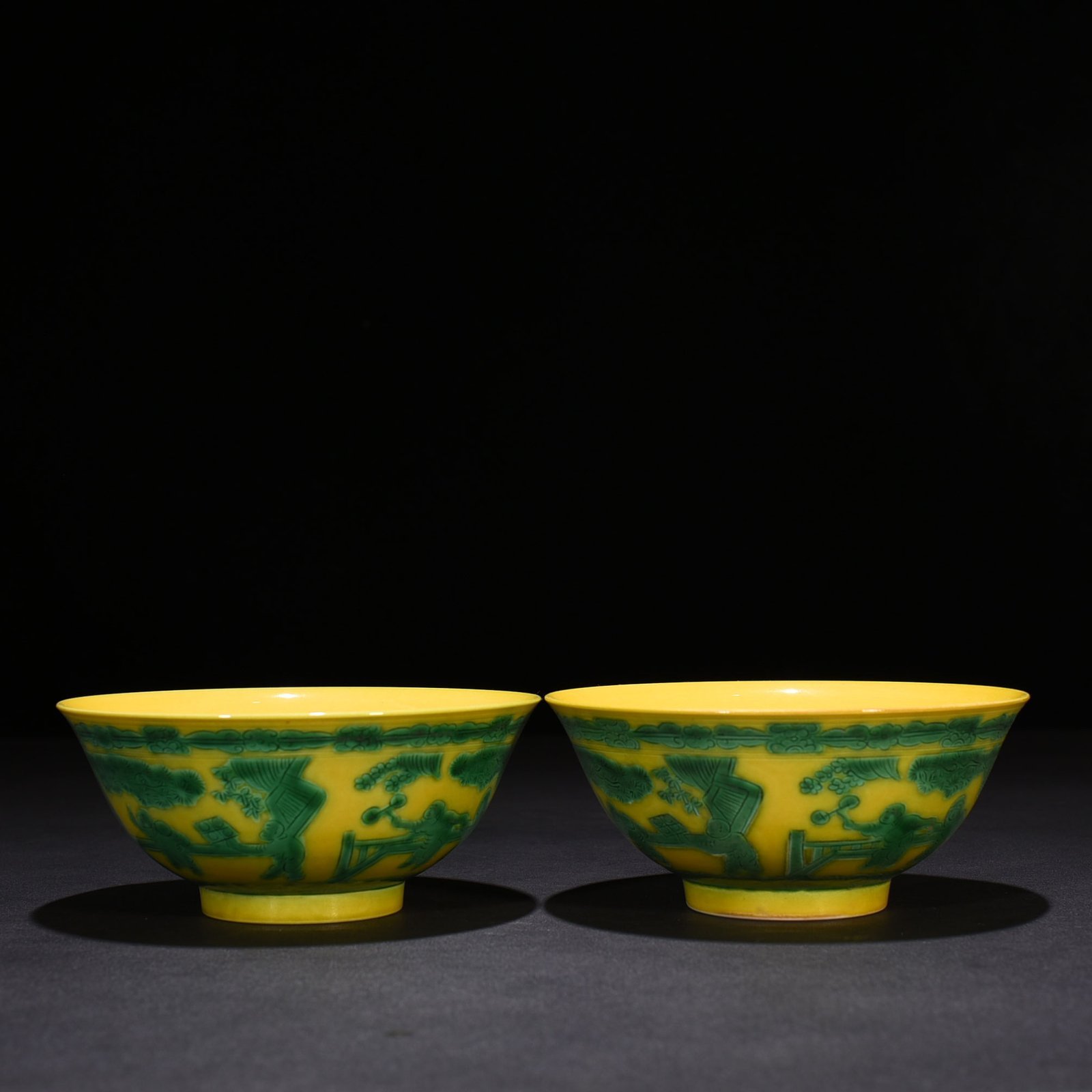 Qing Dynasty Kangxi yellow glaze engraved green color baby playing bowl