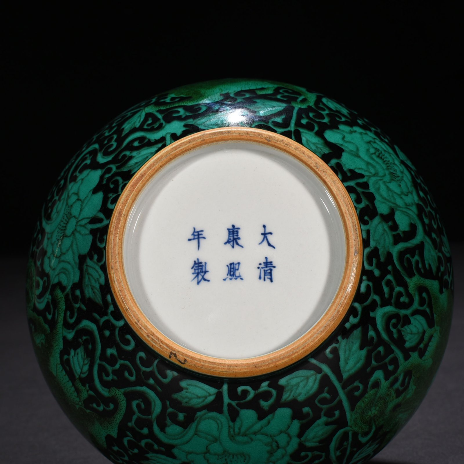 Qing Dynasty Kangxi black ground green glaze straight neck vase