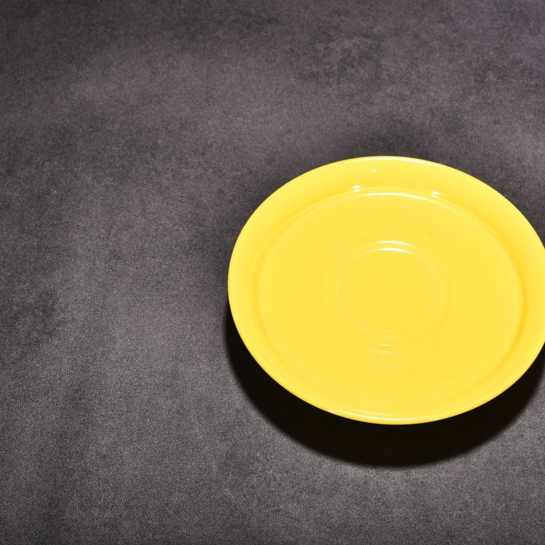 Qing Dynasty Yongzheng lemon yellow glaze three-cai bowl