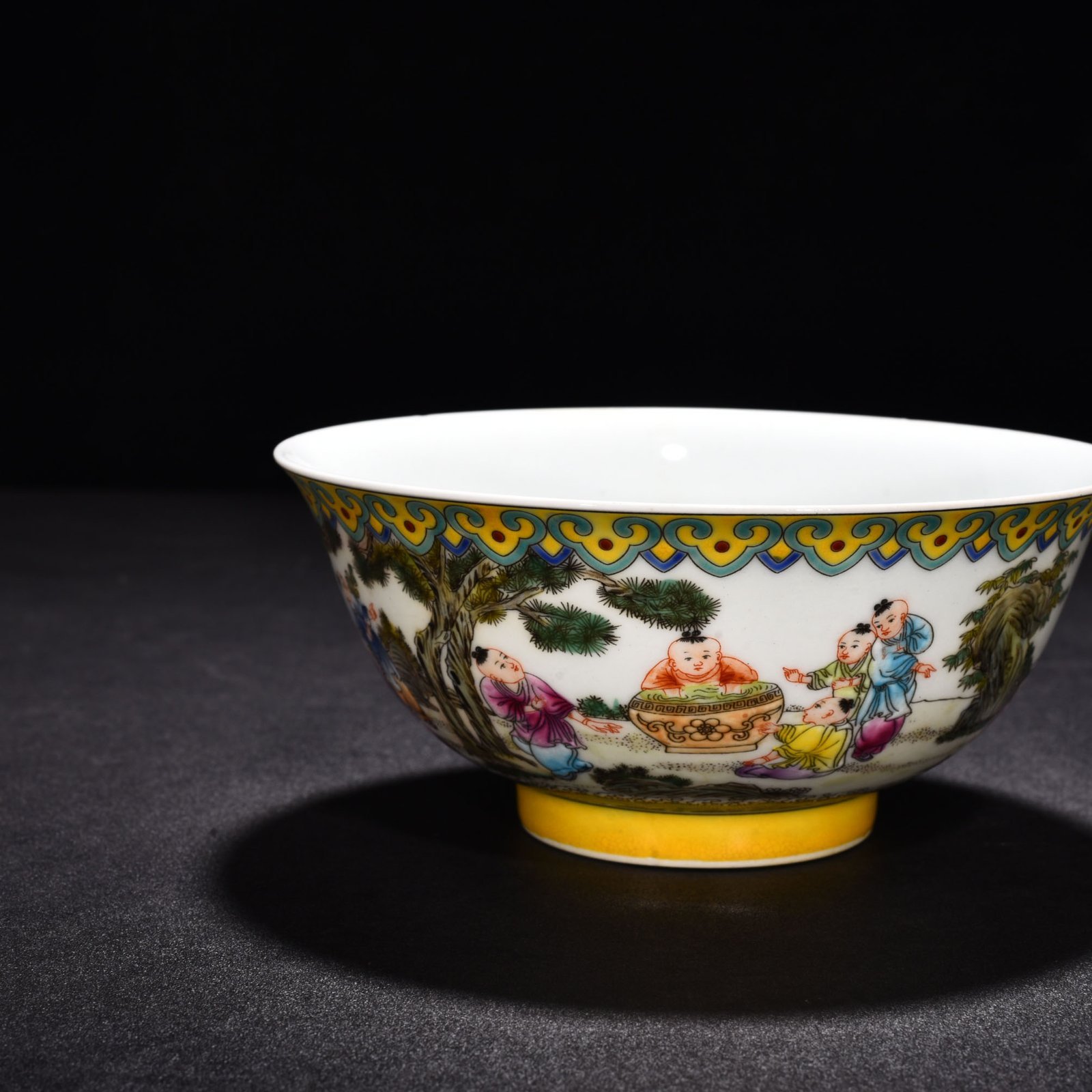 Qing Dynasty Yongzheng enamel palace-style bowl with baby playing