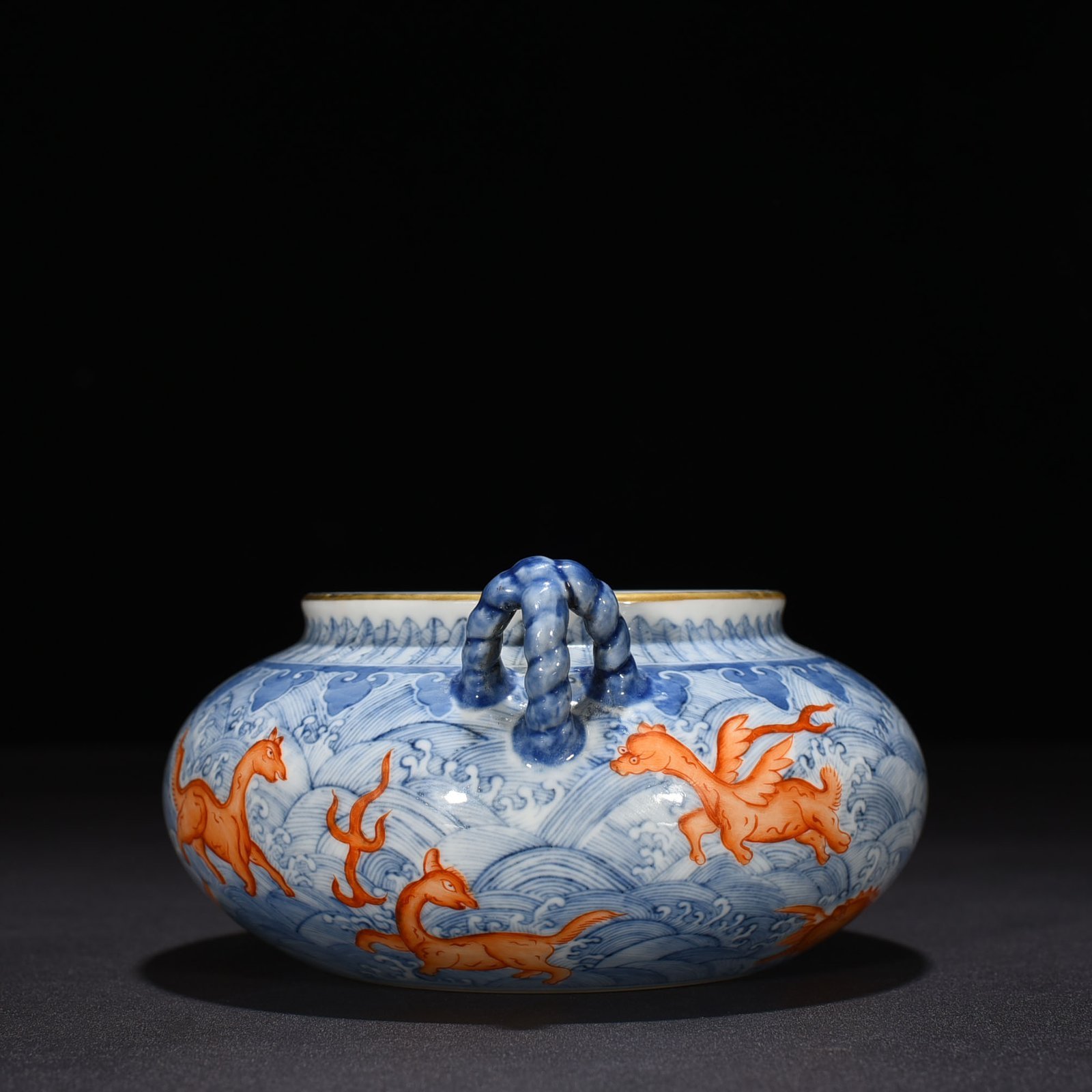 Qing Dynasty Yongzheng blue and white alum red sea eight monster pattern double ear wash