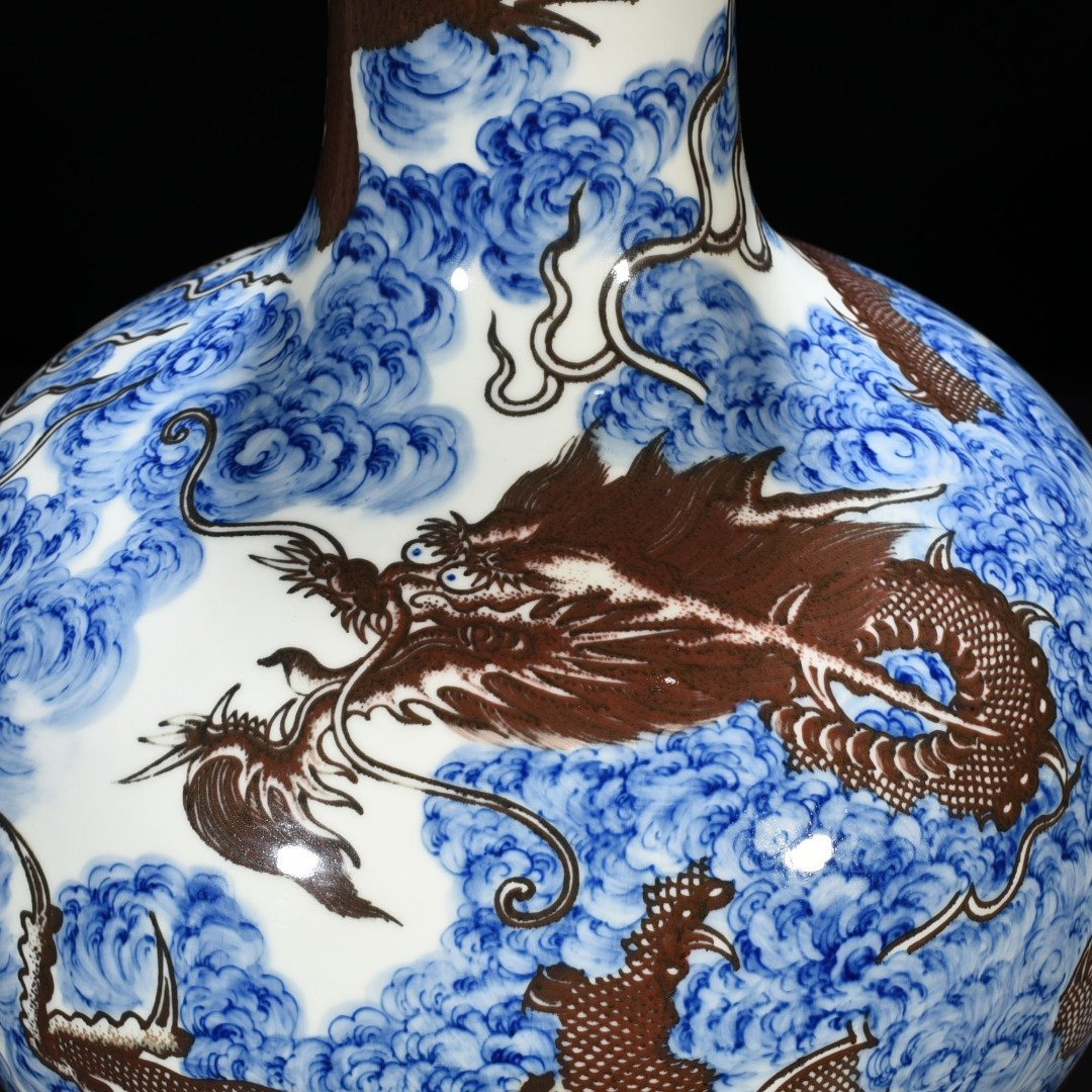 Qing Dynasty Yongzheng blue and white underglaze red sea water cloud and dragon celestial sphere vase