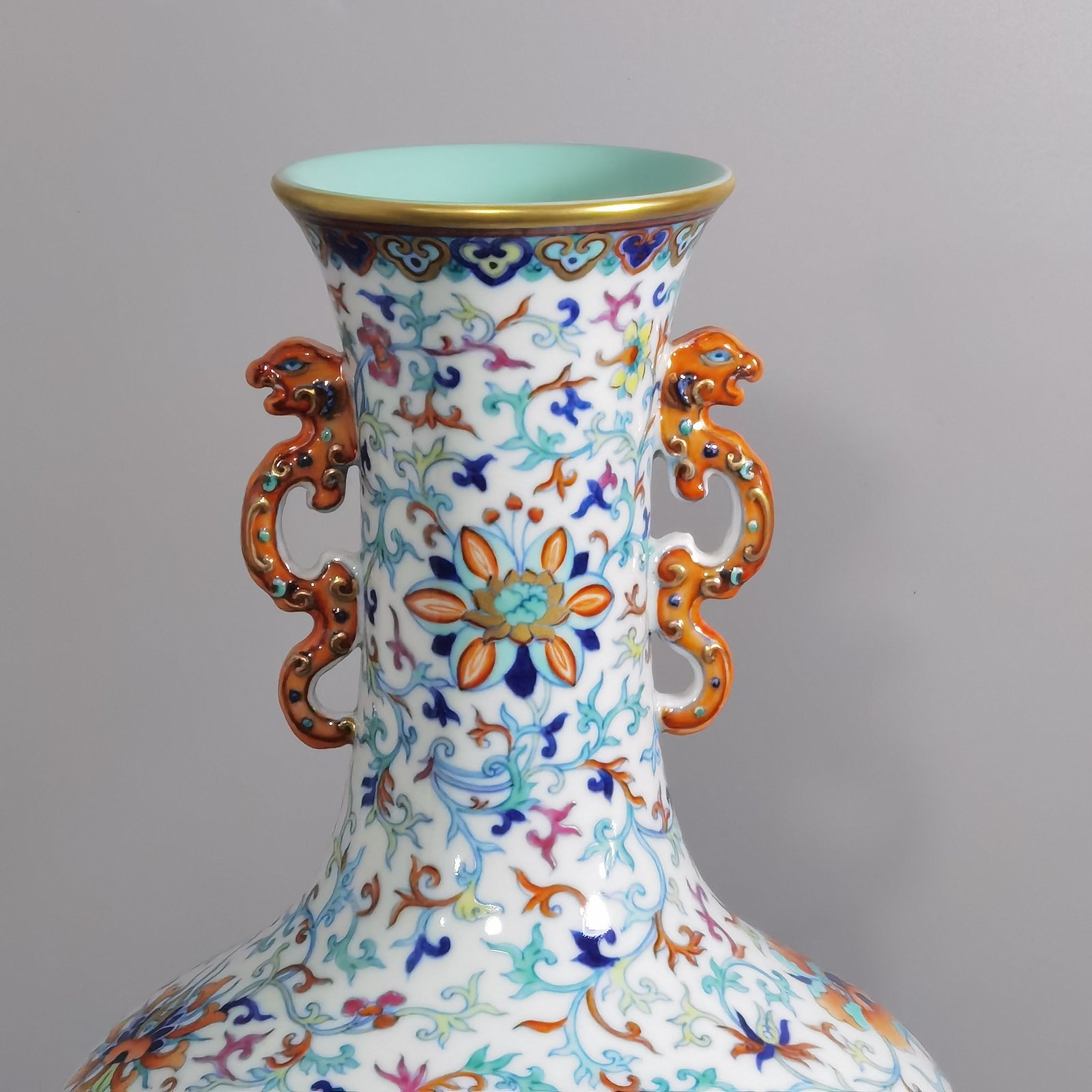 Qing Dynasty Qianlong a doucai-painted gold-twined foreign-style dragon-ear skimming bottle