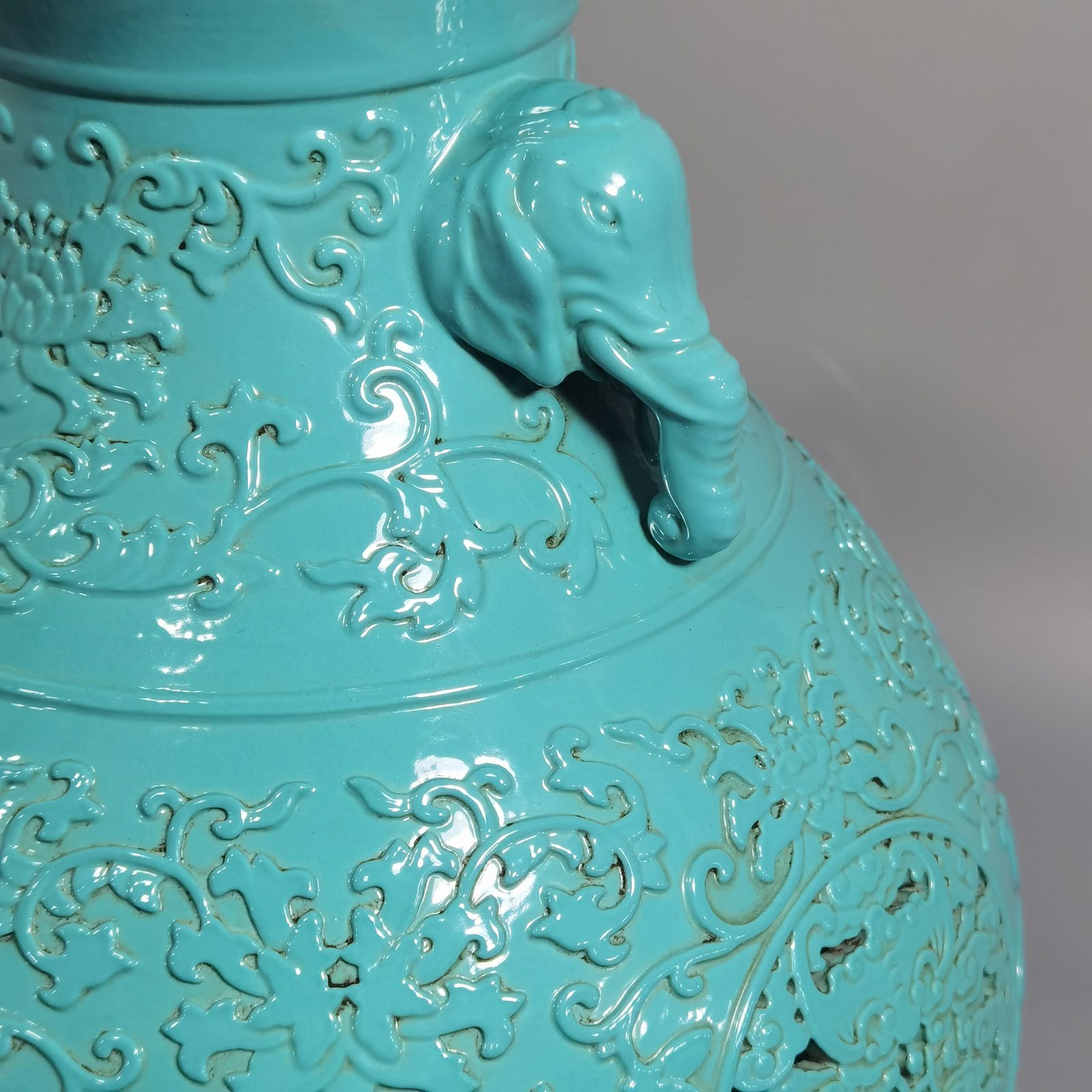 Qing Dynasty Qianlong turquoise green glaze hollow lotus and longevity pattern elephant ear vase