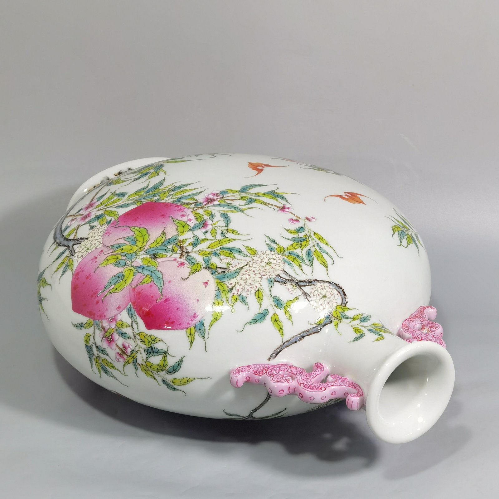 Qing Dynasty Qianlong pastel nine peach and five blessings double-eared moon-holding flat vase