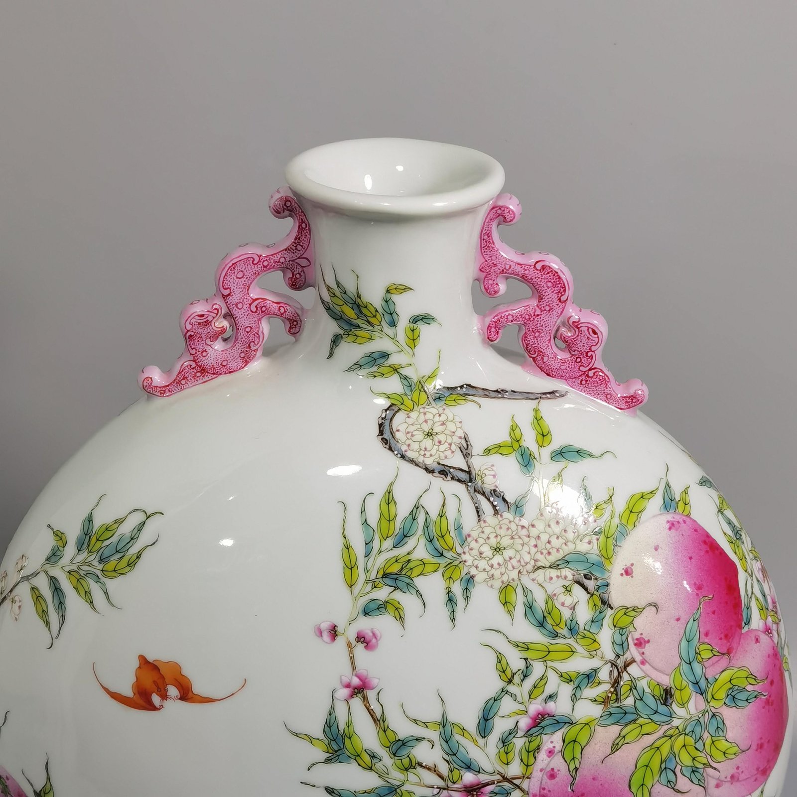 Qing Dynasty Qianlong pastel nine peach and five blessings double-eared moon-holding flat vase