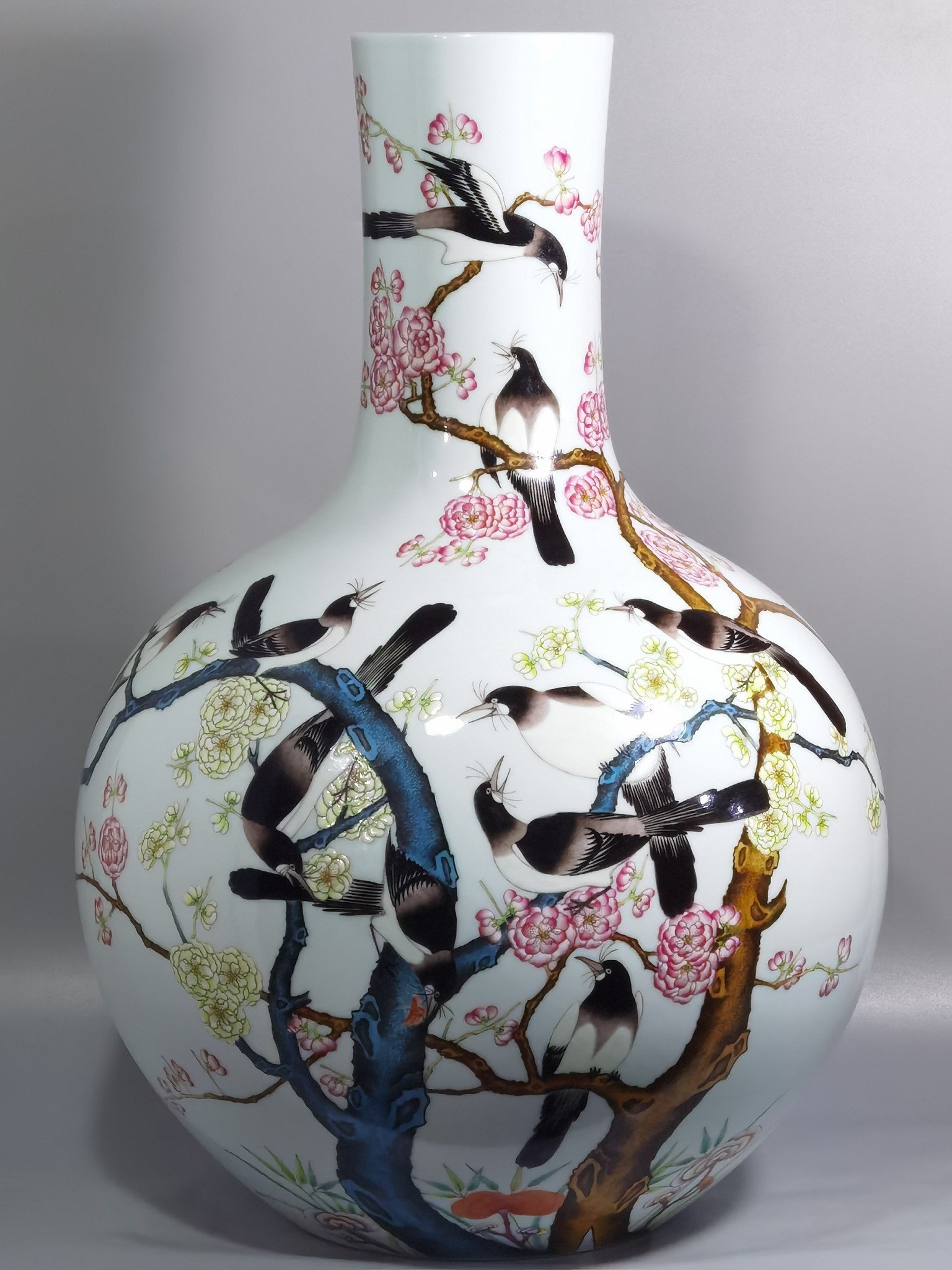 Qing Dynasty Qianlong famille rose twelve magpies ascending plum blossom celestial sphere vase