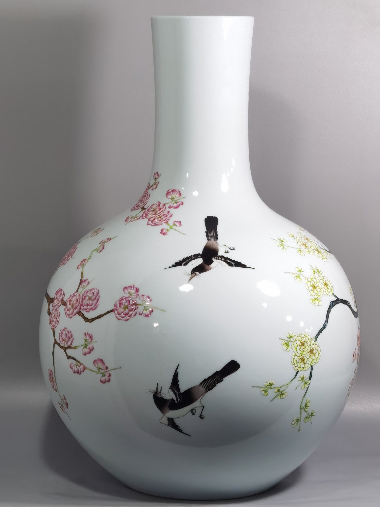 Qing Dynasty Qianlong famille rose twelve magpies ascending plum blossom celestial sphere vase