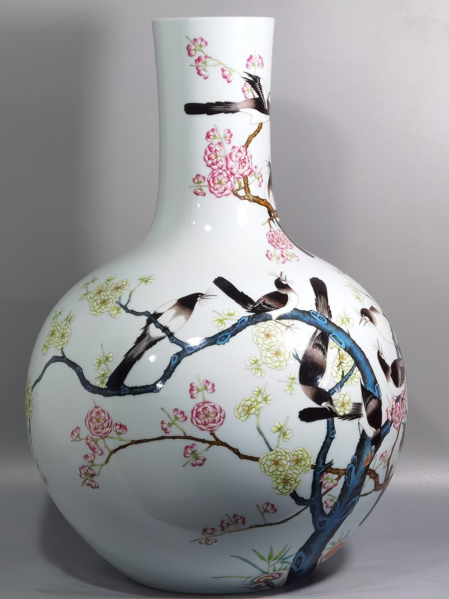Qing Dynasty Qianlong famille rose twelve magpies ascending plum blossom celestial sphere vase