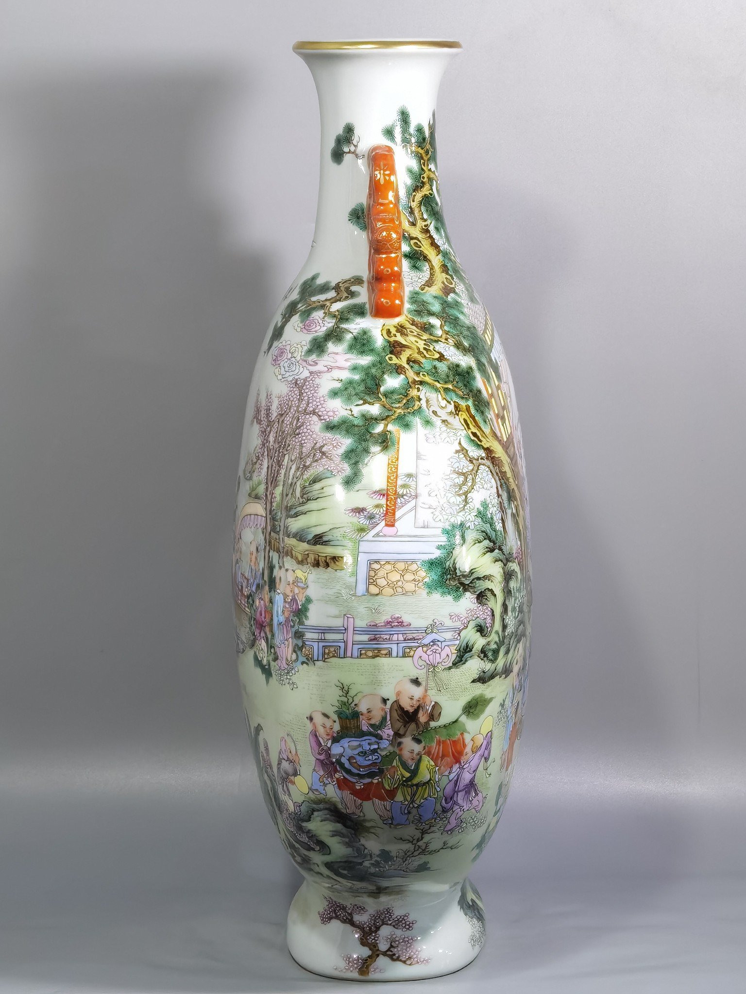 Qing Dynasty Qianlong a pastel-colored baby playing with two ears holding the moon in a flat vase