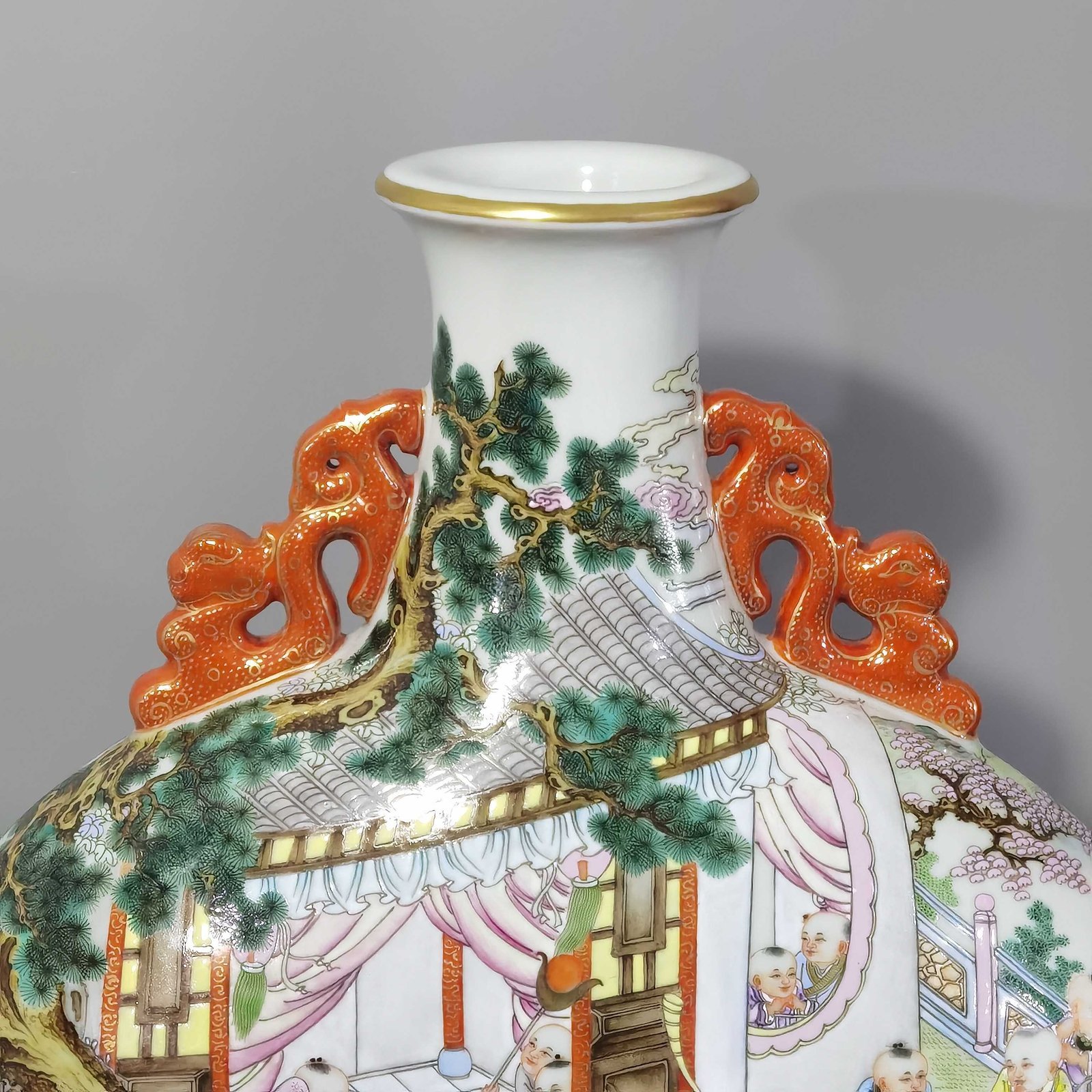 Qing Dynasty Qianlong a pastel-colored baby playing with two ears holding the moon in a flat vase