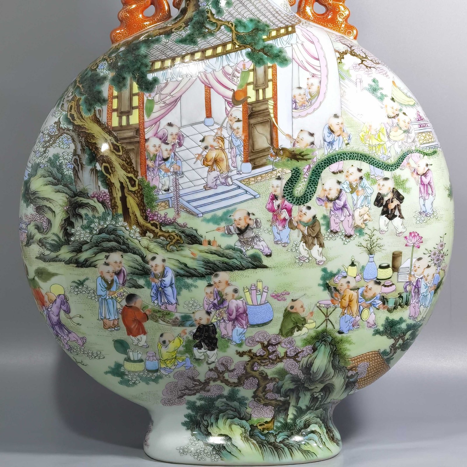 Qing Dynasty Qianlong a pastel-colored baby playing with two ears holding the moon in a flat vase