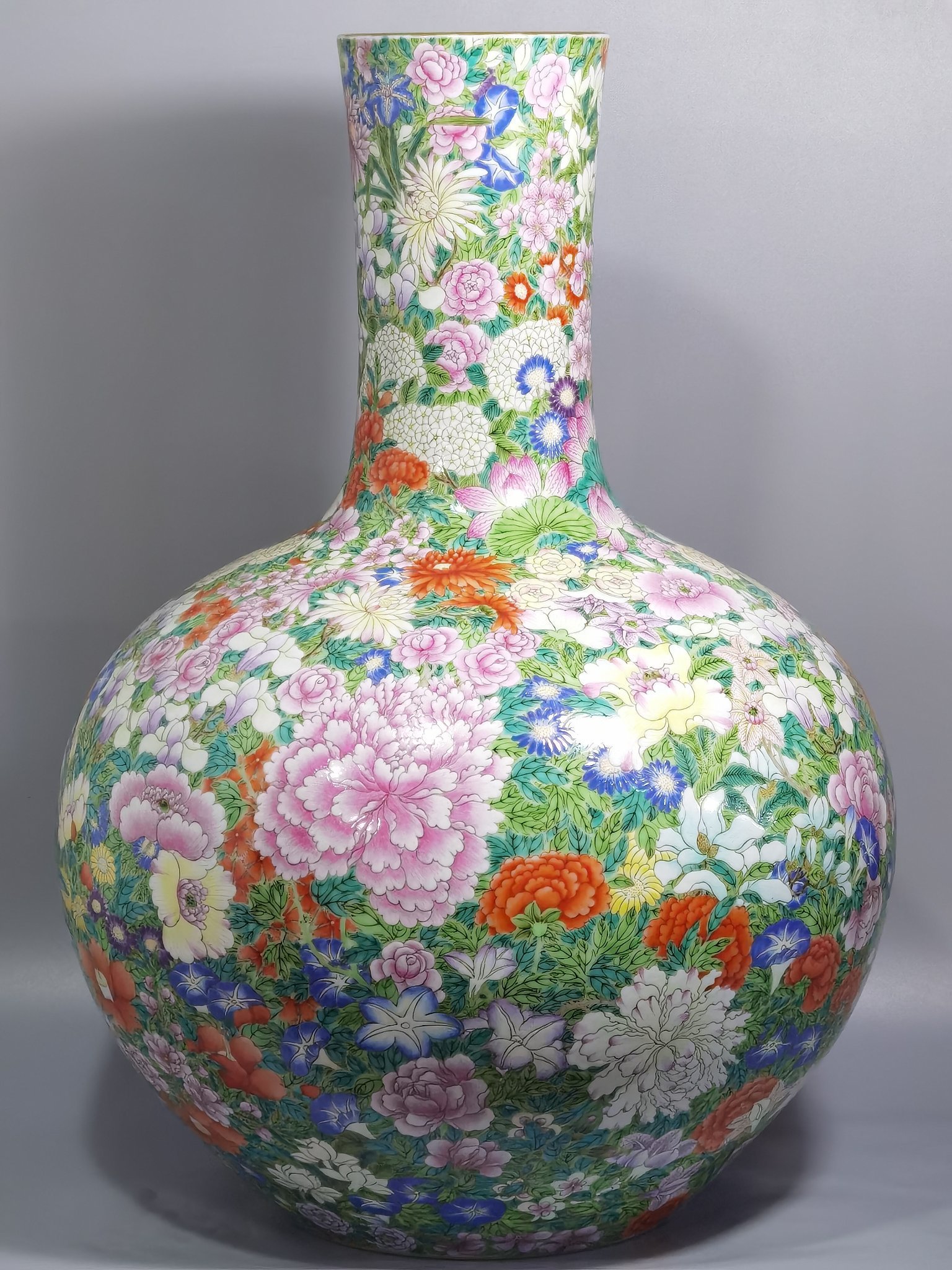 Qing Dynasty Qianlong a pastel colored sky vase with hundreds of flowers