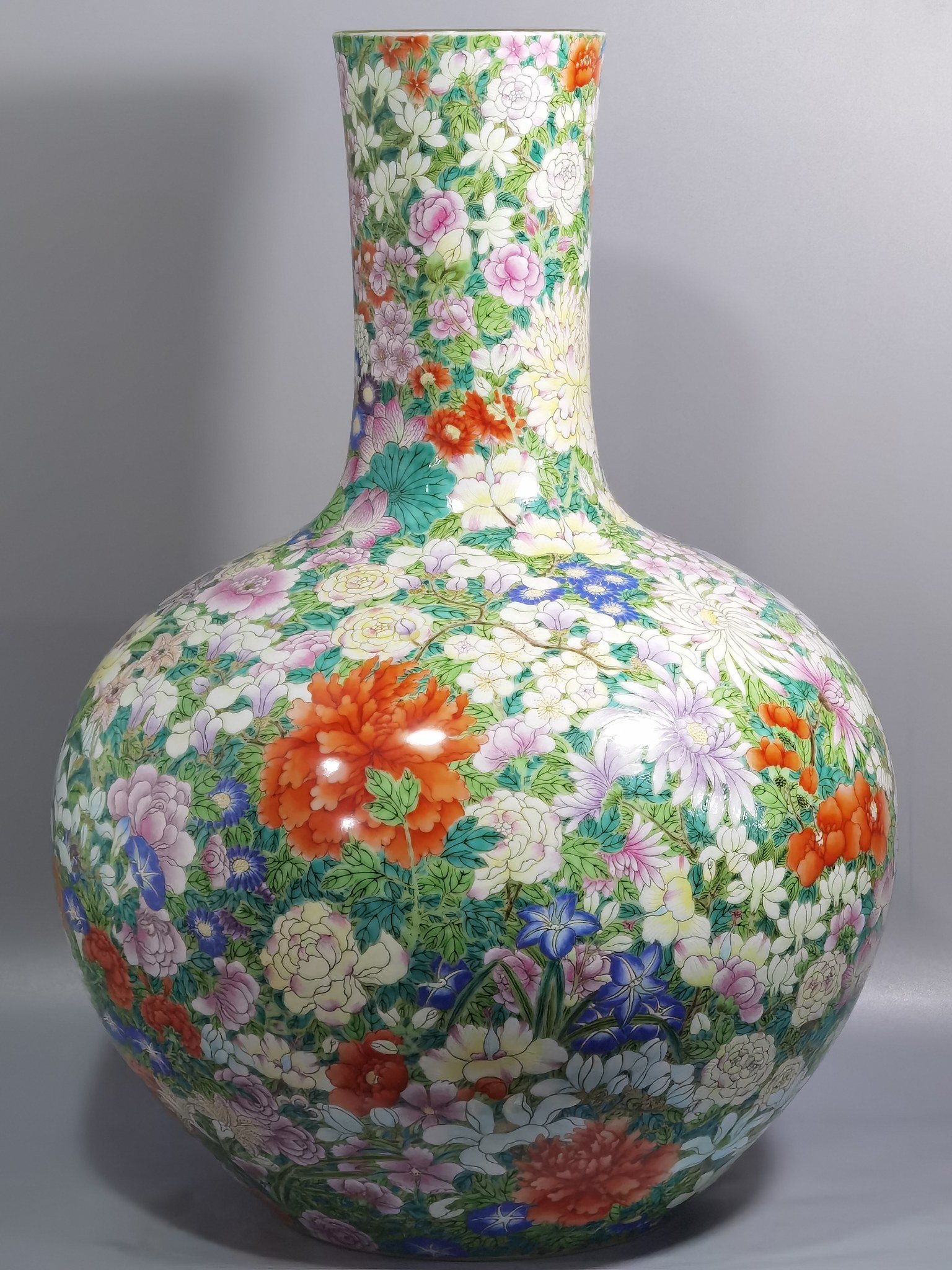 Qing Dynasty Qianlong a pastel colored sky vase with hundreds of flowers