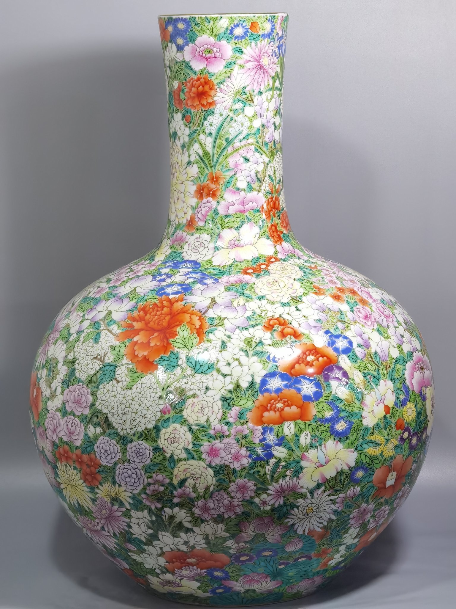Qing Dynasty Qianlong a pastel colored sky vase with hundreds of flowers