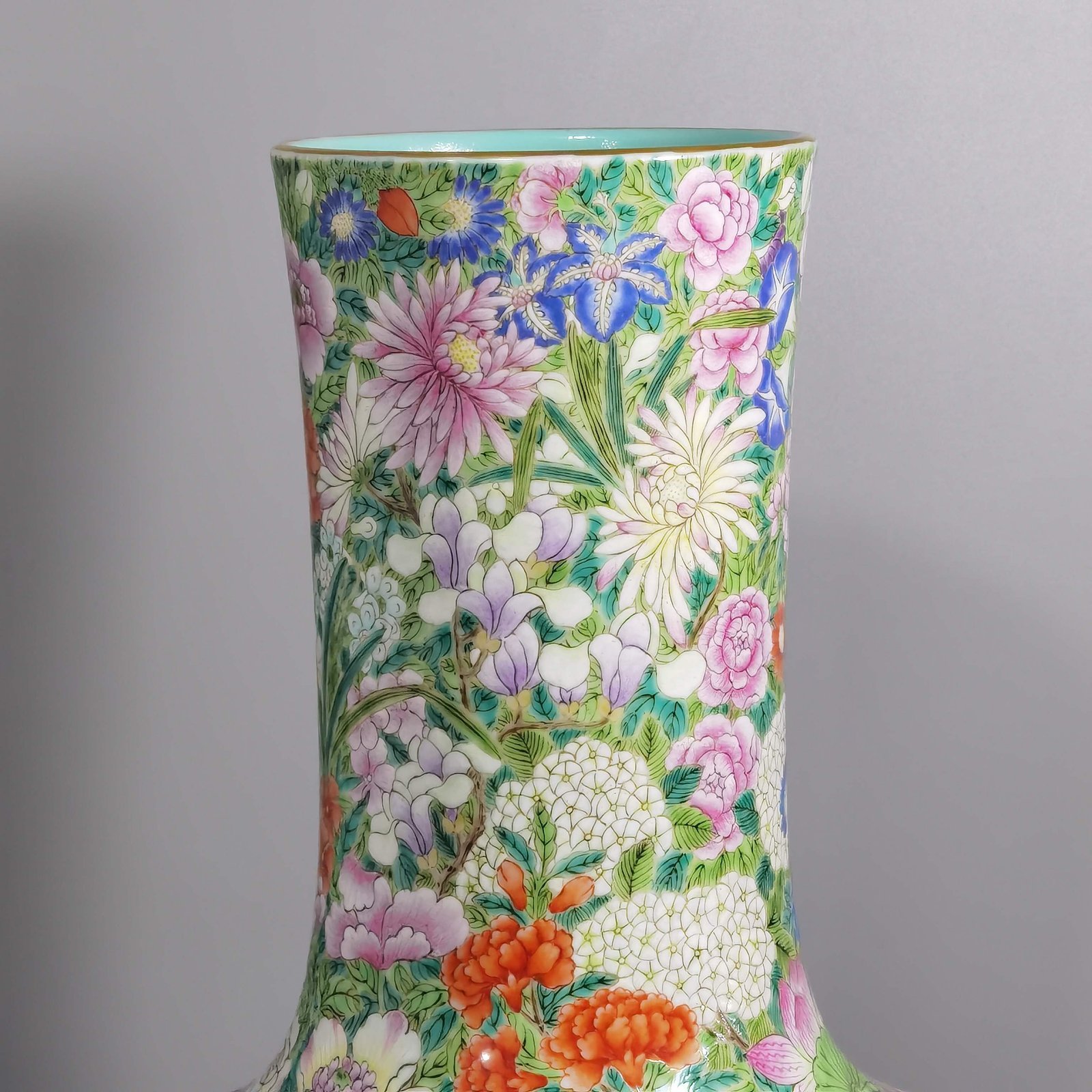 Qing Dynasty Qianlong a pastel colored sky vase with hundreds of flowers