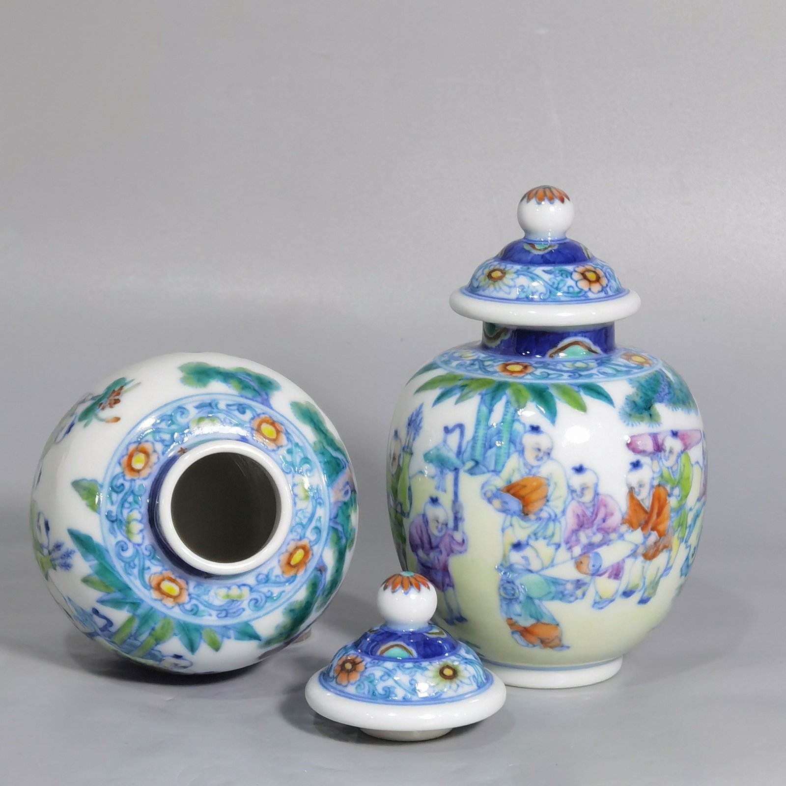 Qing Dynasty Qianlong blue and white colored baby playing picture covered jar
