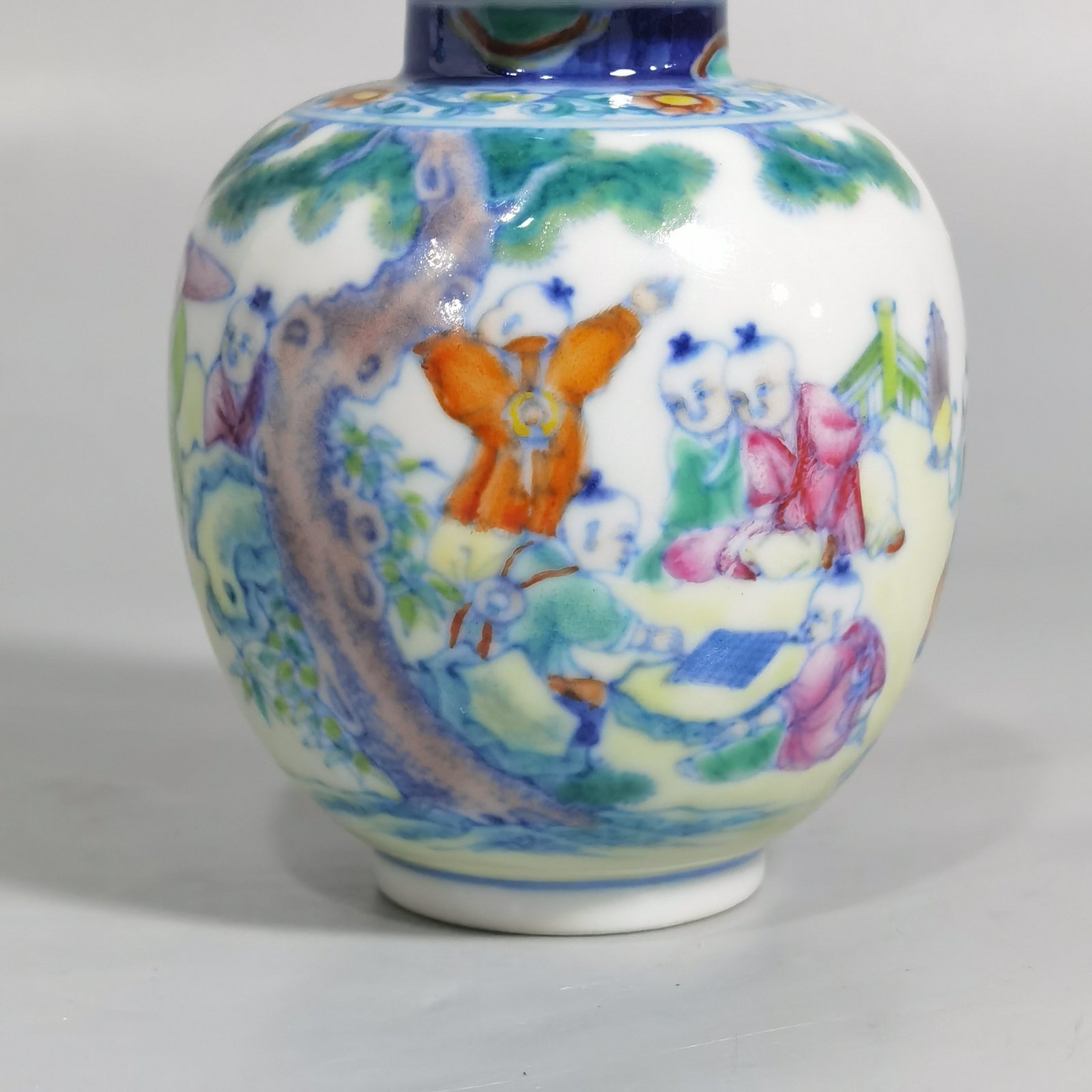 Qing Dynasty Qianlong blue and white colored baby playing picture covered jar