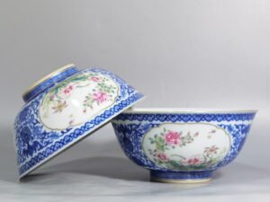 Qing Dynasty Qianlong blue and white longevity and longevity branches windowed pastel flower pattern bowl