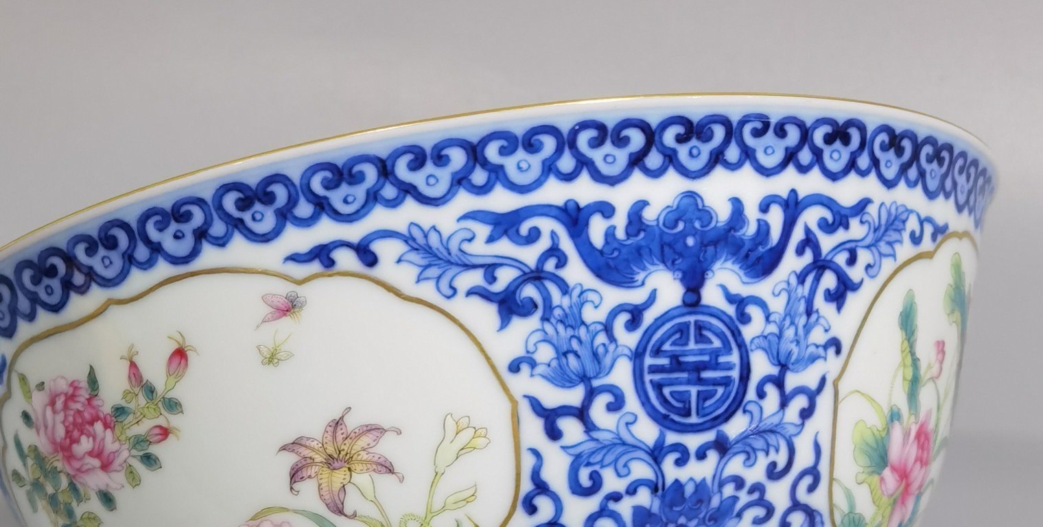 Qing Dynasty Qianlong blue and white longevity and longevity branches windowed pastel flower pattern bowl