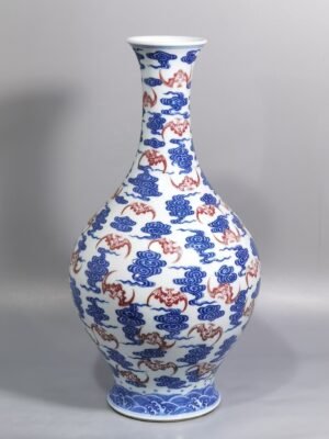 Qing Dynasty Qianlong blue and white underglaze red cloud bat pattern olive vase