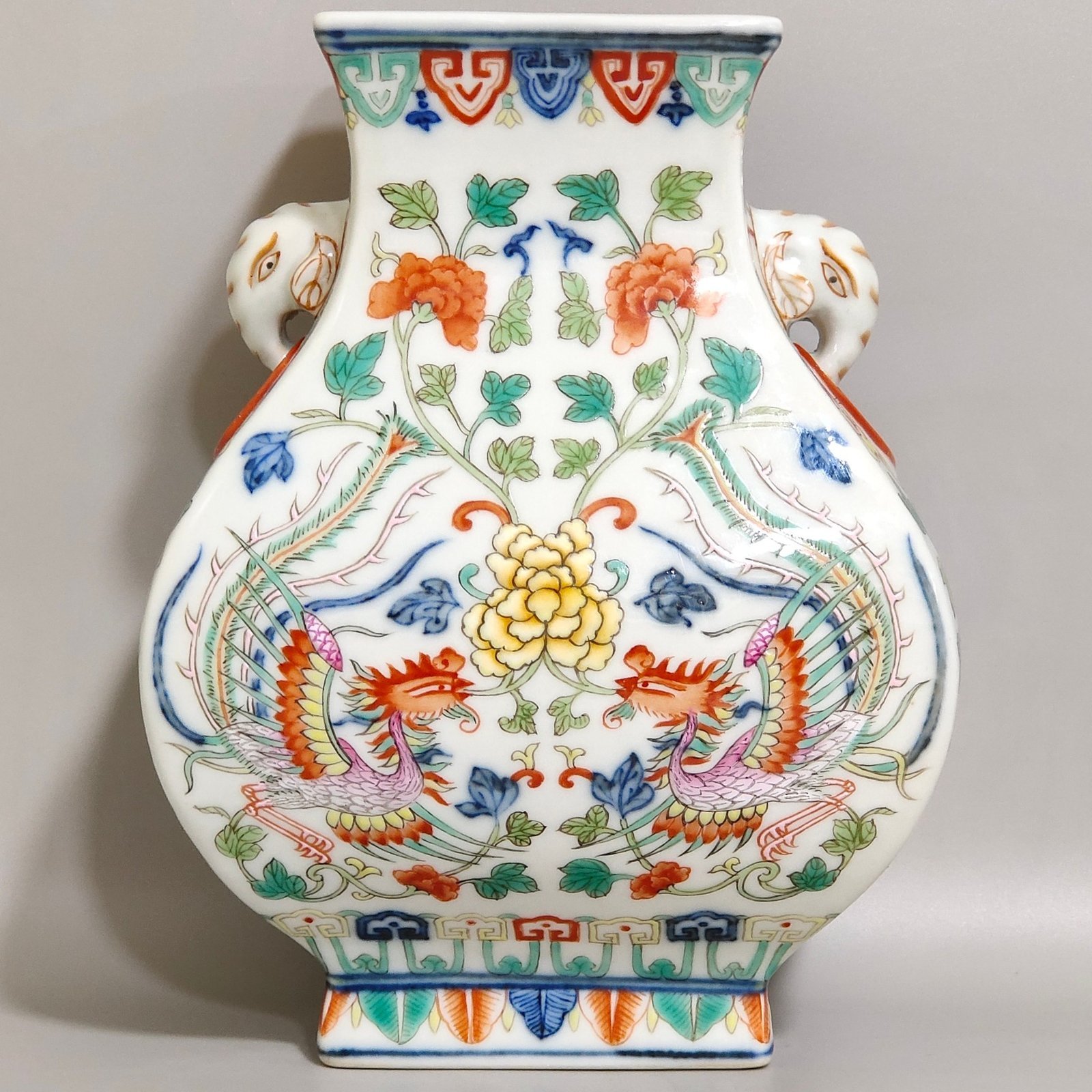 Qing Dynasty Qianlong blue-and-white and polychrome square vase with elephant-head handles